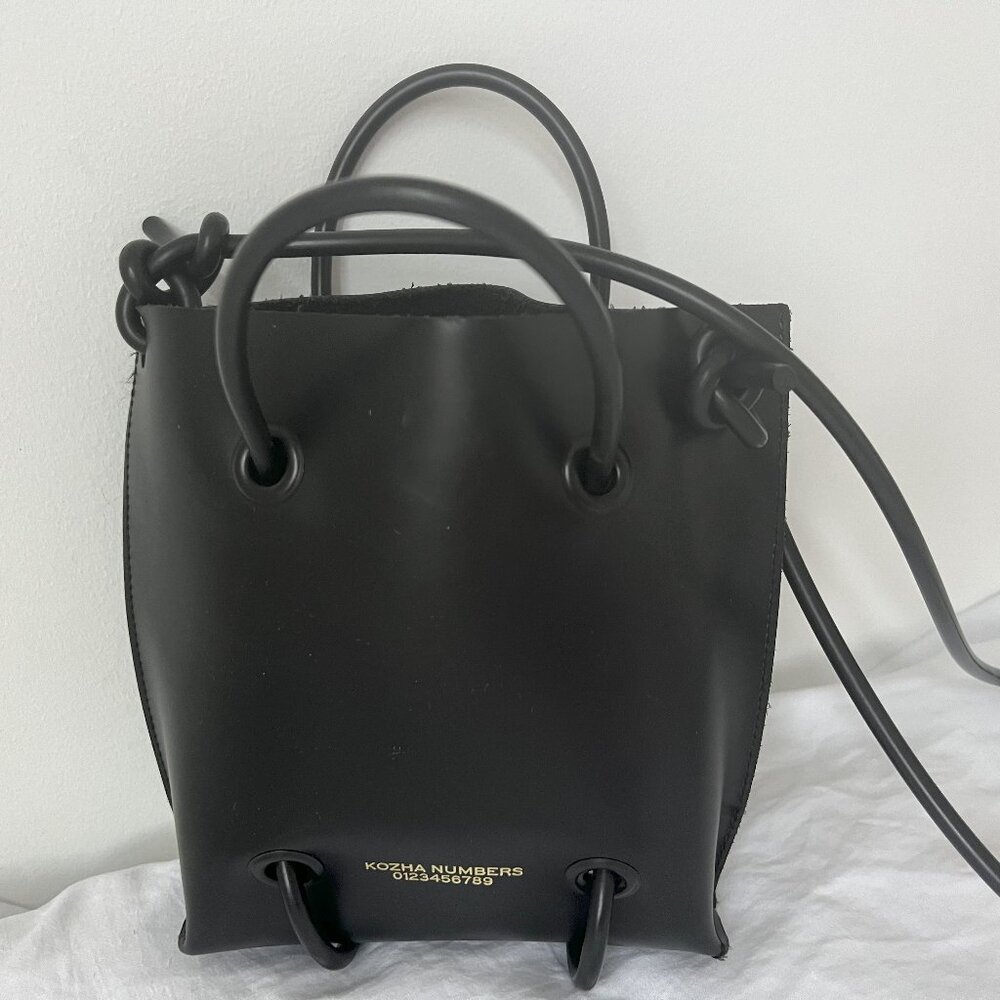 Kozha Numbers calf leather small black purse
